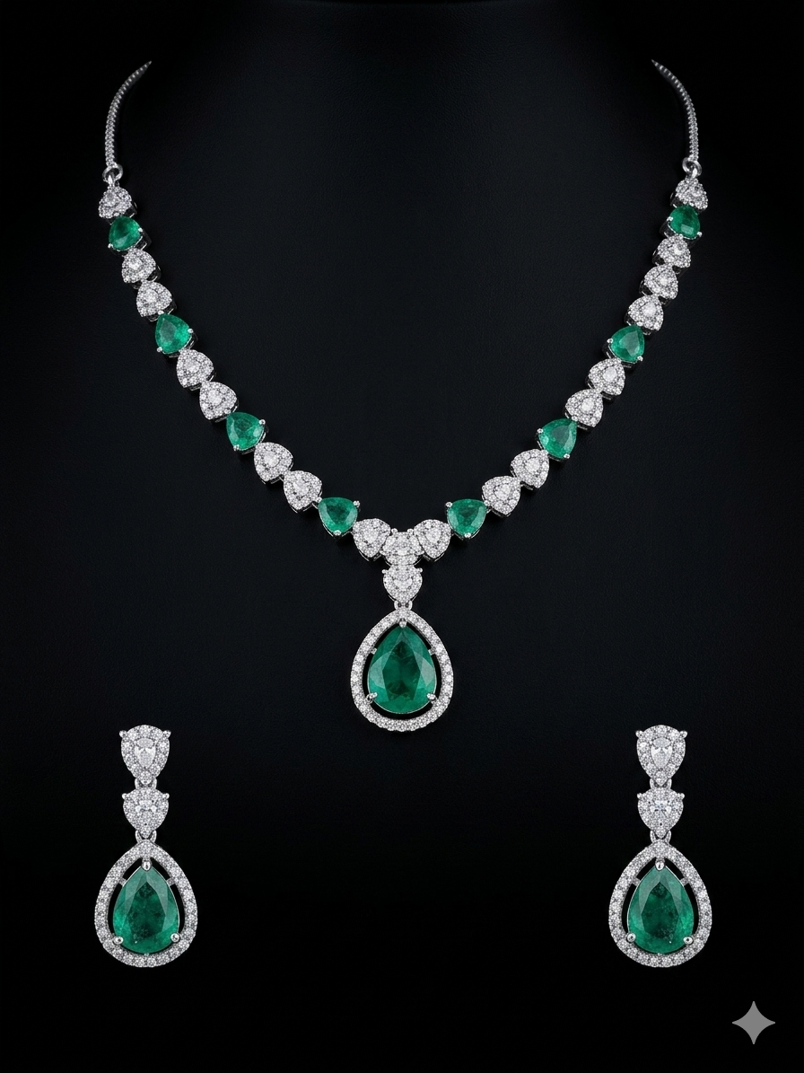 EXQUISITE EMERALD & DIAMOND SET High-grade genuine Zambian emeralds accented with brilliant-cut cubic zirconia.
