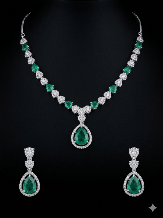 EXQUISITE EMERALD & DIAMOND SET High-grade genuine Zambian emeralds accented with brilliant-cut cubic zirconia.
